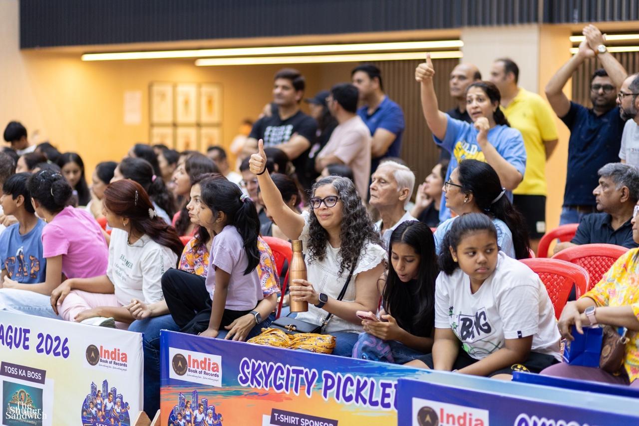 Crowd cheering with thumbs up